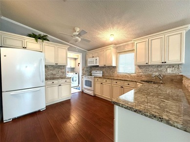 Live the Florida lifestyle you've always imagined in this on Apollo Beach Golf and Sea Club in Florida - for sale on GolfHomes.com, golf home, golf lot