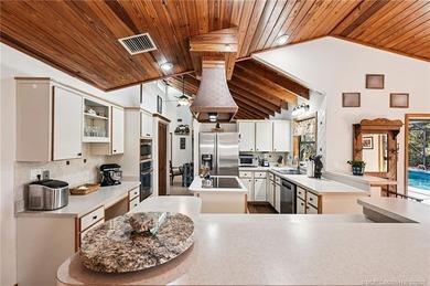 RARE ACRE RETREAT IN MARTIN DOWNS! Experience the perfect blend on Martin Downs Country Club in Florida - for sale on GolfHomes.com, golf home, golf lot