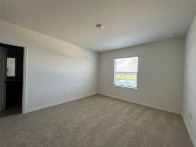 Enjoy Corner-Unit Townhouse with Golf Course Views -Davenport on Ridgewood Lakes Golf and Country Club in Florida - for sale on GolfHomes.com, golf home, golf lot