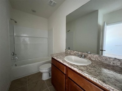 Enjoy Corner-Unit Townhouse with Golf Course Views -Davenport on Ridgewood Lakes Golf and Country Club in Florida - for sale on GolfHomes.com, golf home, golf lot