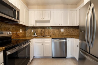 Welcome to this beautifully renovated 3 bed / 2.5 bath corner on Davie Golf Club in Florida - for sale on GolfHomes.com, golf home, golf lot
