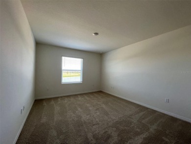 Enjoy Corner-Unit Townhouse with Golf Course Views -Davenport on Ridgewood Lakes Golf and Country Club in Florida - for sale on GolfHomes.com, golf home, golf lot
