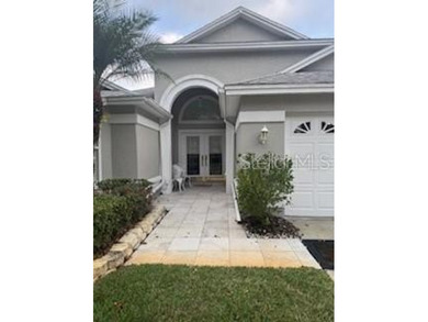 In the beautiful community of Hunters Green, where massive trees on Hunters Green Country Club in Florida - for sale on GolfHomes.com, golf home, golf lot