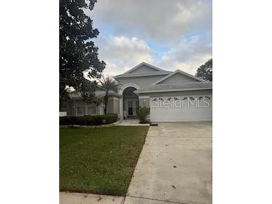 In the beautiful community of Hunters Green, where massive trees on Hunters Green Country Club in Florida - for sale on GolfHomes.com, golf home, golf lot