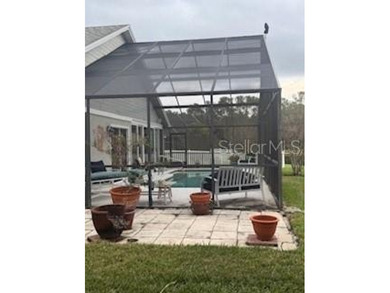 In the beautiful community of Hunters Green, where massive trees on Hunters Green Country Club in Florida - for sale on GolfHomes.com, golf home, golf lot