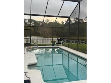 In the beautiful community of Hunters Green, where massive trees on Hunters Green Country Club in Florida - for sale on GolfHomes.com, golf home, golf lot