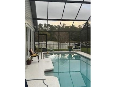 In the beautiful community of Hunters Green, where massive trees on Hunters Green Country Club in Florida - for sale on GolfHomes.com, golf home, golf lot