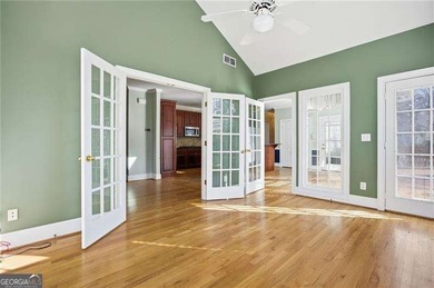 Tucked away on a quiet, double cul-de-sac street is the stately on Brookstone Golf and Country Club in Georgia - for sale on GolfHomes.com, golf home, golf lot