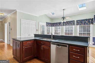 Tucked away on a quiet, double cul-de-sac street is the stately on Brookstone Golf and Country Club in Georgia - for sale on GolfHomes.com, golf home, golf lot