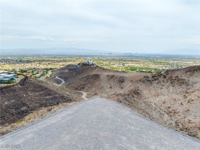 Perched 2,700 ft above the valley floor in double-gated Dragon's on Dragon Ridge Country Club in Nevada - for sale on GolfHomes.com, golf home, golf lot