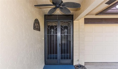 Lovely CBS 3 bedroom, 2 bath, 2 car garage split plan home with on Martin Downs Country Club in Florida - for sale on GolfHomes.com, golf home, golf lot