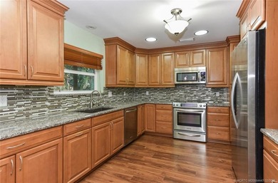 Lovely CBS 3 bedroom, 2 bath, 2 car garage split plan home with on Martin Downs Country Club in Florida - for sale on GolfHomes.com, golf home, golf lot