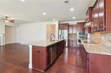 Nestled in the sought-after Traditions of Braselton golf course on Traditions of Braselton Golf Club in Georgia - for sale on GolfHomes.com, golf home, golf lot