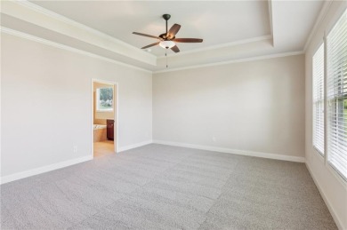 Nestled in the sought-after Traditions of Braselton golf course on Traditions of Braselton Golf Club in Georgia - for sale on GolfHomes.com, golf home, golf lot