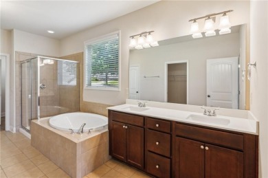 Nestled in the sought-after Traditions of Braselton golf course on Traditions of Braselton Golf Club in Georgia - for sale on GolfHomes.com, golf home, golf lot