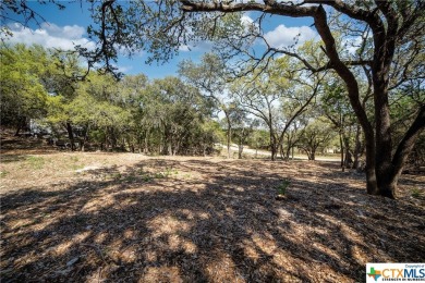 Tree shaded possible 2nd story lake view lot located in Canyon on Canyon Lake Golf Club in Texas - for sale on GolfHomes.com, golf home, golf lot