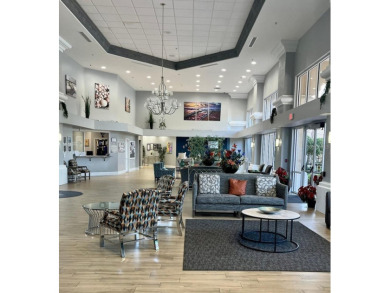 The Florida lifestyle at its finest! Lovely home on the golf on Kings Ridge Golf Club in Florida - for sale on GolfHomes.com, golf home, golf lot