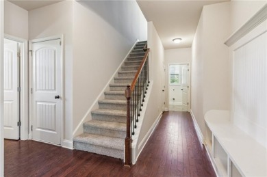 Nestled in the sought-after Traditions of Braselton golf course on Traditions of Braselton Golf Club in Georgia - for sale on GolfHomes.com, golf home, golf lot