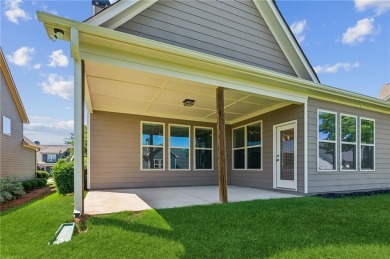 Nestled in the sought-after Traditions of Braselton golf course on Traditions of Braselton Golf Club in Georgia - for sale on GolfHomes.com, golf home, golf lot