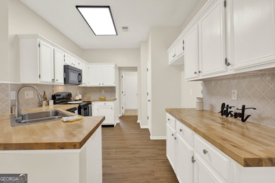 Welcome to this beautifully updated 3-bedroom, 2-bath stepless on Canongate At Eagle Watch Golf Club in Georgia - for sale on GolfHomes.com, golf home, golf lot