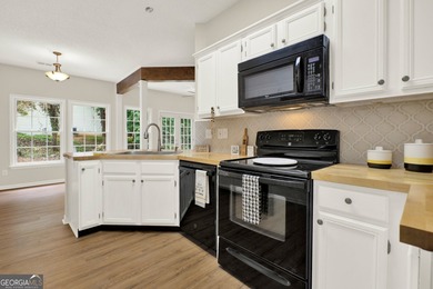 Welcome to this beautifully updated 3-bedroom, 2-bath stepless on Canongate At Eagle Watch Golf Club in Georgia - for sale on GolfHomes.com, golf home, golf lot