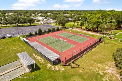 This 3 bedroom, 2 bath property is a lovely place to call homee on Brookridge Country Club in Florida - for sale on GolfHomes.com, golf home, golf lot