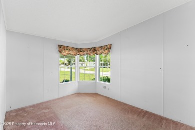 This 3 bedroom, 2 bath property is a lovely place to call homee on Brookridge Country Club in Florida - for sale on GolfHomes.com, golf home, golf lot