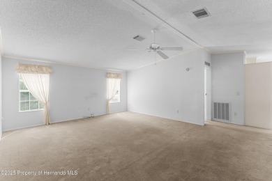This 3 bedroom, 2 bath property is a lovely place to call homee on Brookridge Country Club in Florida - for sale on GolfHomes.com, golf home, golf lot