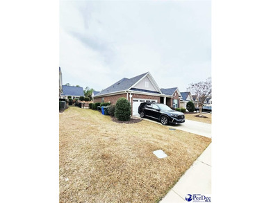 Experience refined living at 309 Dormie Lane, gracefully on The Members Club At Woodcreek in South Carolina - for sale on GolfHomes.com, golf home, golf lot