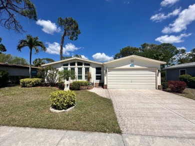 This 2-bedroom, 2 bathrooms Palm Harbor home is located on the on Del Tura Golf and Country Club in Florida - for sale on GolfHomes.com, golf home, golf lot