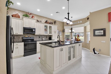 Welcome to this beautifully maintained 3-bedroom, 2-bath home in on Westchester Golf and Country Club in Florida - for sale on GolfHomes.com, golf home, golf lot