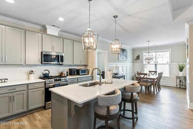 This like new, charming residence, built in 2023 by Bill Clark on Compass Pointe Golf Course in North Carolina - for sale on GolfHomes.com, golf home, golf lot