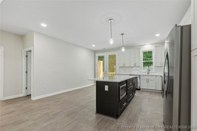 Easy living with this open floor plan, new construction in the on Carolina Trace Country Club in North Carolina - for sale on GolfHomes.com, golf home, golf lot