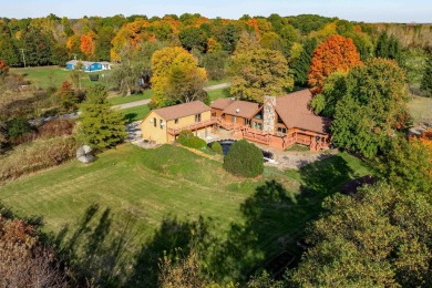 This stunning property offers the perfect blend of luxury and on Hickory Creek Golf Course in Michigan - for sale on GolfHomes.com, golf home, golf lot