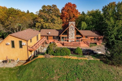 This stunning property offers the perfect blend of luxury and on Hickory Creek Golf Course in Michigan - for sale on GolfHomes.com, golf home, golf lot