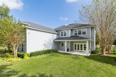 This elegant two story sits on a spectacular half-acre corner on St. Johns Golf and Country Club in Florida - for sale on GolfHomes.com, golf home, golf lot