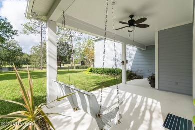 This elegant two story sits on a spectacular half-acre corner on St. Johns Golf and Country Club in Florida - for sale on GolfHomes.com, golf home, golf lot