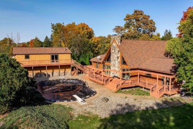 This stunning property offers the perfect blend of luxury and on Hickory Creek Golf Course in Michigan - for sale on GolfHomes.com, golf home, golf lot