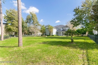 This elegant two story sits on a spectacular half-acre corner on St. Johns Golf and Country Club in Florida - for sale on GolfHomes.com, golf home, golf lot