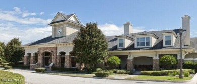 This elegant two story sits on a spectacular half-acre corner on St. Johns Golf and Country Club in Florida - for sale on GolfHomes.com, golf home, golf lot