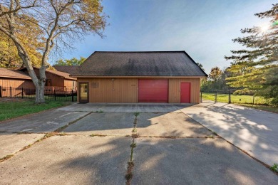 This stunning property offers the perfect blend of luxury and on Hickory Creek Golf Course in Michigan - for sale on GolfHomes.com, golf home, golf lot