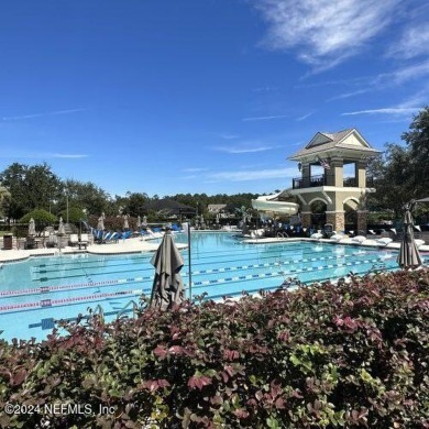 This elegant two story sits on a spectacular half-acre corner on St. Johns Golf and Country Club in Florida - for sale on GolfHomes.com, golf home, golf lot