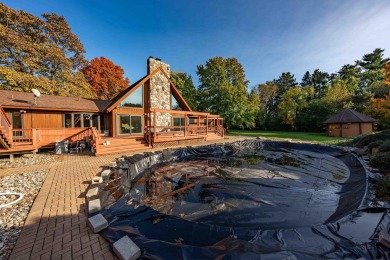 This stunning property offers the perfect blend of luxury and on Hickory Creek Golf Course in Michigan - for sale on GolfHomes.com, golf home, golf lot