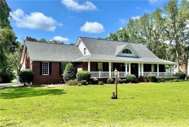 Imagine mornings on your spacious covered front porch or on Okefenokee Country Club in Georgia - for sale on GolfHomes.com, golf home, golf lot