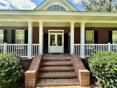 Imagine mornings on your spacious covered front porch or on Okefenokee Country Club in Georgia - for sale on GolfHomes.com, golf home, golf lot