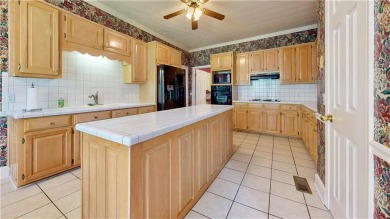 Imagine mornings on your spacious covered front porch or on Okefenokee Country Club in Georgia - for sale on GolfHomes.com, golf home, golf lot