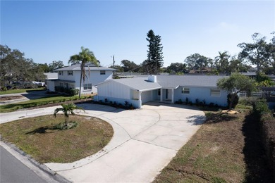 Situated in St Petersburg's highly sought after community on Pasadena Yacht and Country Club in Florida - for sale on GolfHomes.com, golf home, golf lot