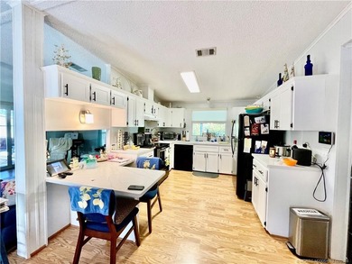 Delightful, remodeled home on a corner lot! Complete storm on Indianwood Golf and Country Club in Florida - for sale on GolfHomes.com, golf home, golf lot