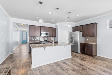 Located in the gated community of Waters Edge, this 3-bedroom on Tidewater Golf Club and Plantation in South Carolina - for sale on GolfHomes.com, golf home, golf lot