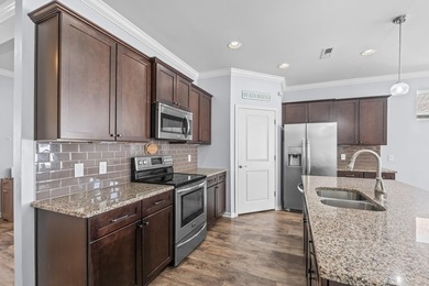 Located in the gated community of Waters Edge, this 3-bedroom on Tidewater Golf Club and Plantation in South Carolina - for sale on GolfHomes.com, golf home, golf lot